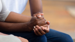 Couple holding hands during marriage counseling in Fairfax, VA. Couples therapy in Fairfax, VA and Woodbridge, VA helps you feel more secure in your marriage.