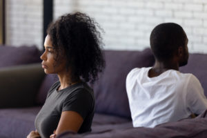 Married couple facing away from each other with arms crossed and looking upset about the lack of communication in their marriage. Couples therapy in Fairfax, VA can help you communicate more openly. Marriage counseling in Fairfax, VA can help you feel more connected at The Center for Connection, Healing and Change. 22032